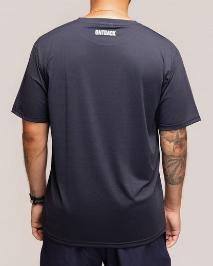 Man wearing a black t-shirt with 'OnTrack' branding on the back, standing against a plain background.